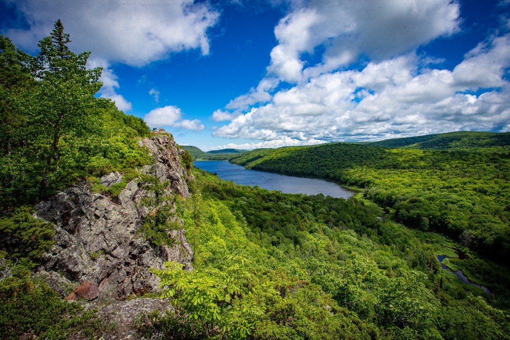 Seen from the viewing platform of Lake of the Clouds with landscape on the left and the clouds over the lake.