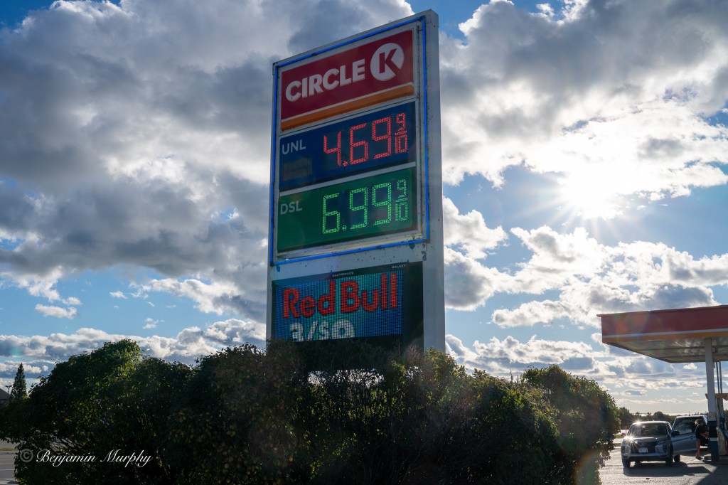 A gas sign with the price of gas and diesel on it.